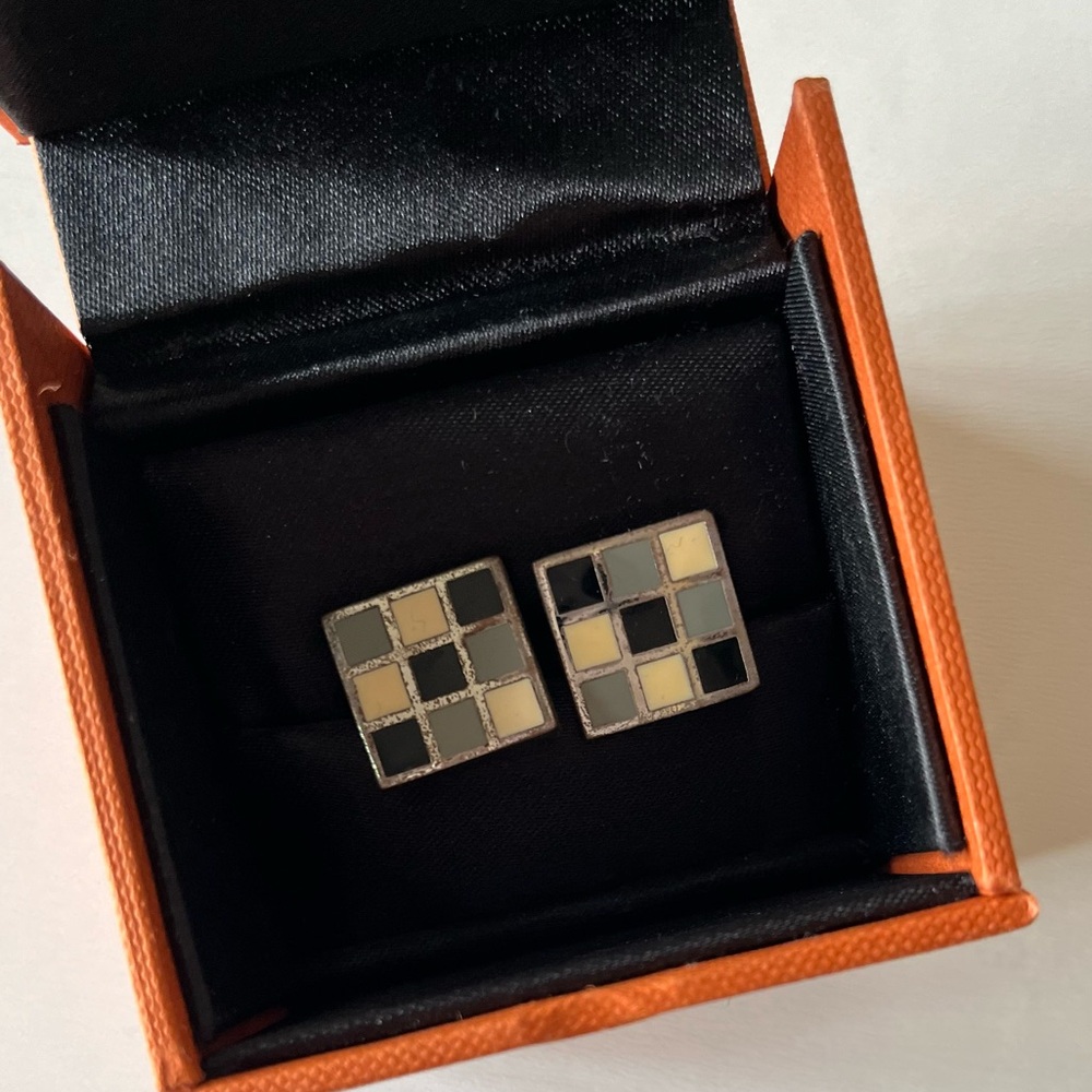 Simon Carter checkerboard cuff links.